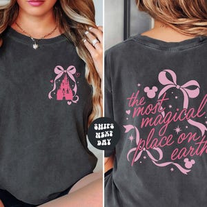 The image is a collage of two photos showing the back and front of a gray t-shirt with a pink bow and text.