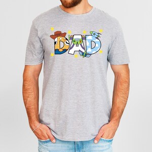 a man with a beard wearing a t - shirt that says dad