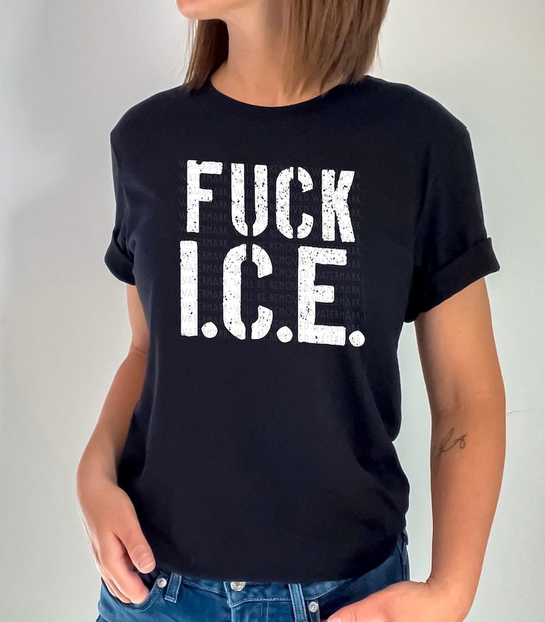 a woman wearing a black t - shirt with the words fuck ice printed on it