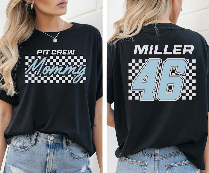 A woman wearing a black t-shirt with a checkered pattern and the text "PIT CIRCLE MOMMY 46" printed on it.