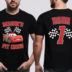 A man wearing a black t-shirt with a personalized design featuring a red car and the text "Mason's Pit Crew" and the number "1" on the back.
