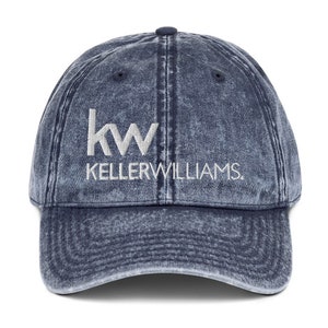 May include: A blue denim baseball cap with a white embroidered logo that says "kw KELLERWILLIAMS."