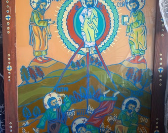 May include: Hand-painted religious icon featuring figures with halos, set against a landscape. The artwork is framed in a dark wood frame with gold accents. The figures are depicted in vibrant colors, with text inscriptions.