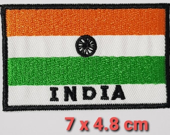 May include: An embroidered patch of the Indian flag with the words "INDIA" below. The flag is orange, white, and green with a blue wheel in the centre. The patch is 7 cm by 4.8 cm.