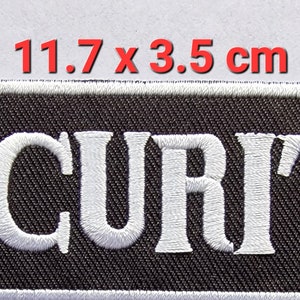 Peut inclure: Patch rectangulaire noir avec le texte "SECURITY" brodé en blanc. Le patch mesure 11,7 cm sur 3,5 cm.