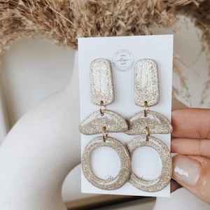 Polymer clay earrings. Sparkly earrings. Eras tour earrings. Gold earrings. Christmas earrings. NYE earrings. Holiday earrings