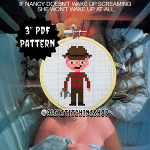 May include: A 3-inch PDF cross-stitch pattern featuring a pixelated illustration of Freddy Krueger from the movie "A Nightmare on Elm Street". The pattern is displayed in a wooden embroidery hoop against a backdrop of a movie poster.