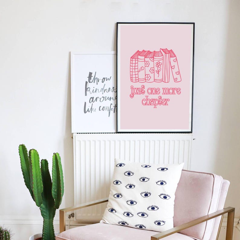 May include: Pink and white framed print with a stack of books and the text "Just one more chapter".