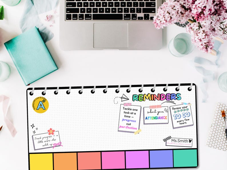 May include: A white planner with a black cover and silver rings. The planner has a dotted grid pattern and colorful sticky notes with reminders that say "Tackle one task at a time - progress not perfection", "Submit your attendance", and "Review your to do every few hours".