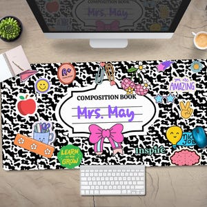 May include: Black and white leopard print desk mat with colourful school-themed stickers and the text "COMPOSITION BOOK Mrs. May".