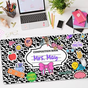 May include: Black and white leopard print composition book with colourful stickers and the text "Composition Book Mrs. May" in a purple font.