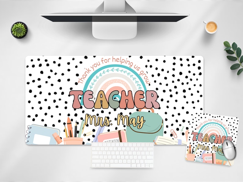 May include: A white and black polka dot desk mat with a rainbow and the text "Thank you for helping us grow" and "Teacher Mrs. May". The mat also includes a notebook, pencils, and a backpack.