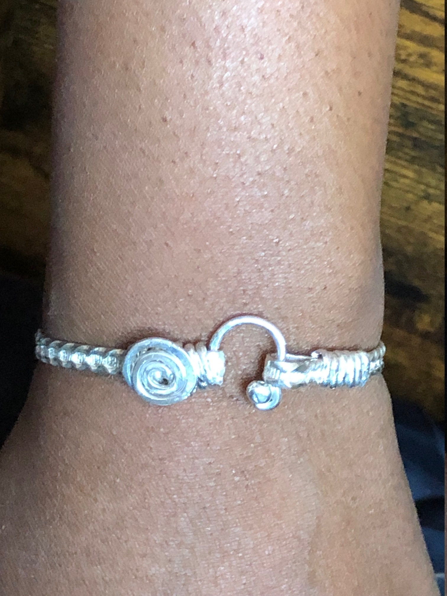 Classic Caribbean swirl hook bracelet in all .925 sterling silver. Handcrafted Wire wrapped bracelet.