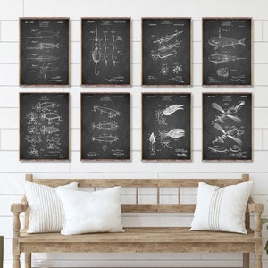 May include: Set of eight black and white vintage fishing lure patent prints. The prints are framed and hung on a white wall above a wooden bench.
