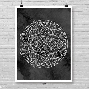 May include: A black and white mandala design on a dark gray background. The mandala is intricate and detailed, with a circular pattern of flowers and leaves.
