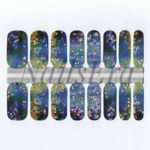 May include: A set of 10 nail wraps with a blue, green, and gold glitter design. The nail wraps are on a white background with the text "NailsEra" printed on a silver strip.
