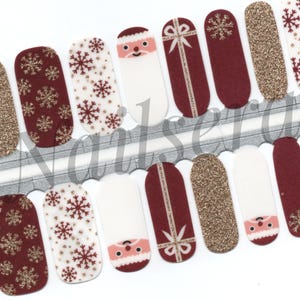 Weihnachtliche Nagelfolien in Rot, Weiß und Gold: Einfach anzubringende Nagellackaufkleber.