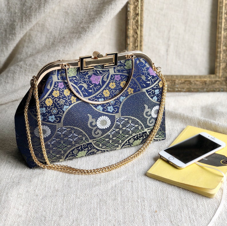 Vintage cheongsam style kiss lock hand bag with navy blue nishijin Japanese traditional patterns style with gold frame, clasp and chain. image 8