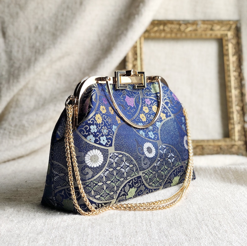 Vintage cheongsam style kiss lock hand bag with navy blue nishijin Japanese traditional patterns style with gold frame, clasp and chain. image 2