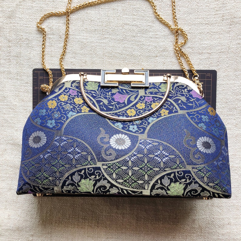 Vintage cheongsam style kiss lock hand bag with navy blue nishijin Japanese traditional patterns style with gold frame, clasp and chain. image 7