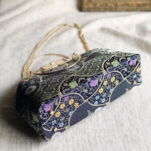 Vintage cheongsam style kiss lock hand bag with navy blue nishijin Japanese traditional patterns style with gold frame, clasp and chain. image 4
