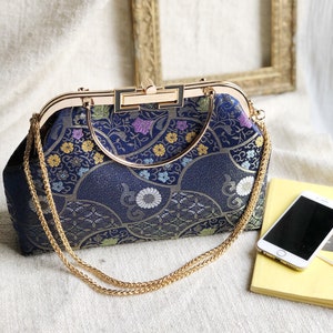 Vintage cheongsam style kiss lock hand bag with navy blue nishijin Japanese traditional patterns style with gold frame, clasp and chain. image 9