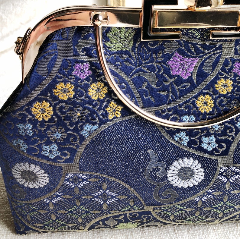 Vintage cheongsam style kiss lock hand bag with navy blue nishijin Japanese traditional patterns style with gold frame, clasp and chain. image 5