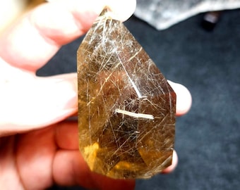 Rutilated smoky quartz freeform crystal from Brazil. Rutile quartz crystal