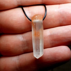 Unique clear quartz crystal pendant with orange phantom