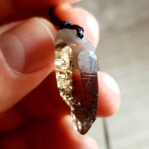 Cathedral smoky quartz crystal pendant with aegirine inclusions