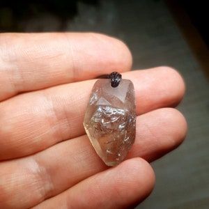 Cathedral smoky quartz crystal pendant with aegirine inclusions