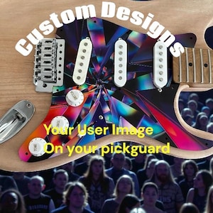 May include: A custom electric guitar with a wooden body and a pickguard featuring a colorful, geometric design. The pickguard has the text "Your User Image On your pickguard" and "Custom Designs". The guitar has white pickups and chrome hardware.