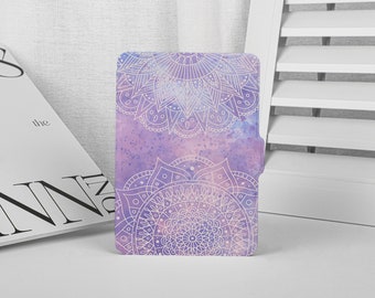May include: A purple and pink phone case with a white mandala design.
