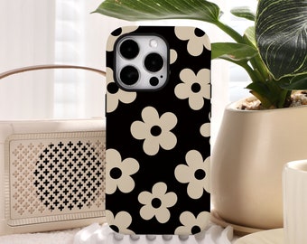 May include: Black phone case with a pattern of beige daisy flowers.