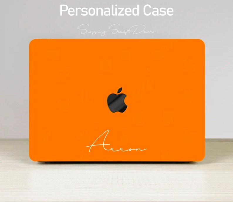 May include: Orange laptop case with a black Apple logo and the name "Arron" written in white script.