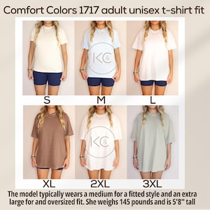 May include: A display of Comfort Colors 1717 adult unisex t-shirts in various colours and sizes, from S to 3XL. The model wears a medium for a fitted style and an extra large for an oversized fit. The model is 173 cm tall and weighs 65.8 kg.