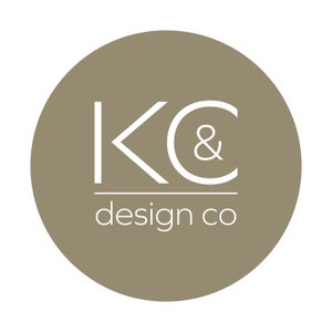 May include: A brown circle with the text "KC & design co" in white.