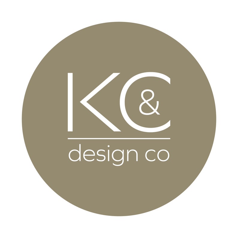 May include: A brown circle with the text "KC & design co" in white.