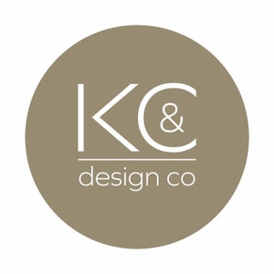 May include: A brown circle with a white logo that says "KC & design co" in a minimalist font.