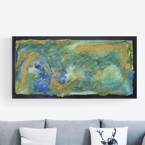 May include: Abstract painting with swirling blue, green, and gold paint. The painting is framed in a black frame.