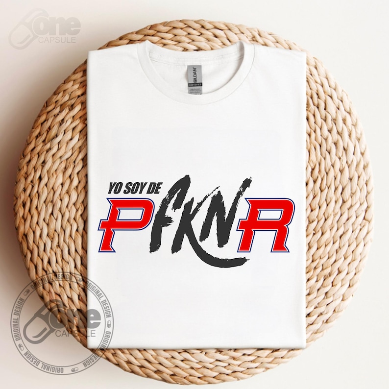 May include: White t-shirt with a black and red graphic that says "Yo soy de PFKN" with a red "R" and a black circle around the "N".