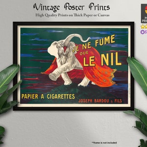 May include: Vintage poster print featuring a white elephant wearing a red and orange cape, walking towards the right. The poster has the text "Je ne fume que le Nil" and "Papier a Cigarettes Joseph Bardou & Fils".