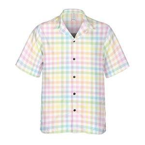 May include: A short-sleeved button-down shirt with a pastel plaid pattern in shades of pink, yellow, green, and blue. The shirt has a classic collar and black buttons. The fabric appears lightweight.