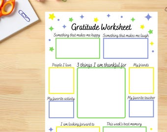 May include: A white "Gratitude Worksheet" with colourful star and dot accents. The worksheet includes prompts such as "Something that makes me happy" and "3 things I am thankful for". The worksheet is surrounded by stationery.