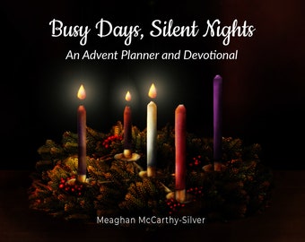 May include: A dark background with a green wreath and four lit candles. The candles are purple, white, red, and blue. The text "Busy Days, Silent Nights" is above the wreath and the text "An Advent Planner and Devotional" is below the wreath. The text "Meaghan McCarthy-Silver" is at the bottom of the image.