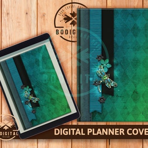 May include: Digital planner cover with a green and blue ombre background. The cover features a black and blue striped ribbon, a black ribbon, and a dragonfly with green and blue wings and a black body. The dragonfly is adorned with rhinestones.