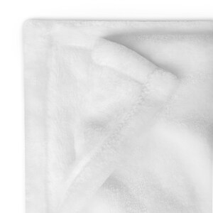 May include: A white plush blanket folded in half, showing the soft texture of the fabric.