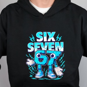 May include: Black hoodie with a graphic design featuring the words "SIX SEVEN" in light blue, outlined in white. The numbers 6 and 7 are personified with cartoon faces, arms, legs, and shoes. Lightning bolt accents surround the text and numbers.
