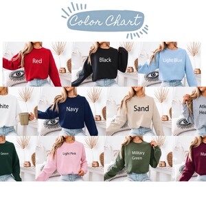 May include: A colour chart showing crewneck sweatshirts in a range of colours. The colours include red, black, light blue, white, navy, sand, athletic heather, forest green, light pink, military green, and maroon.