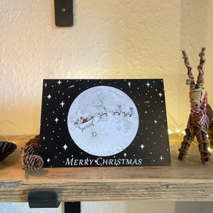 Kerstkaart | Vrolijk kerstfeest | Kerstman | Kerstman | Sleekaart | Rendierkaart | Rudolf | Maan | Illustratie | A5-kaart | Kunst: